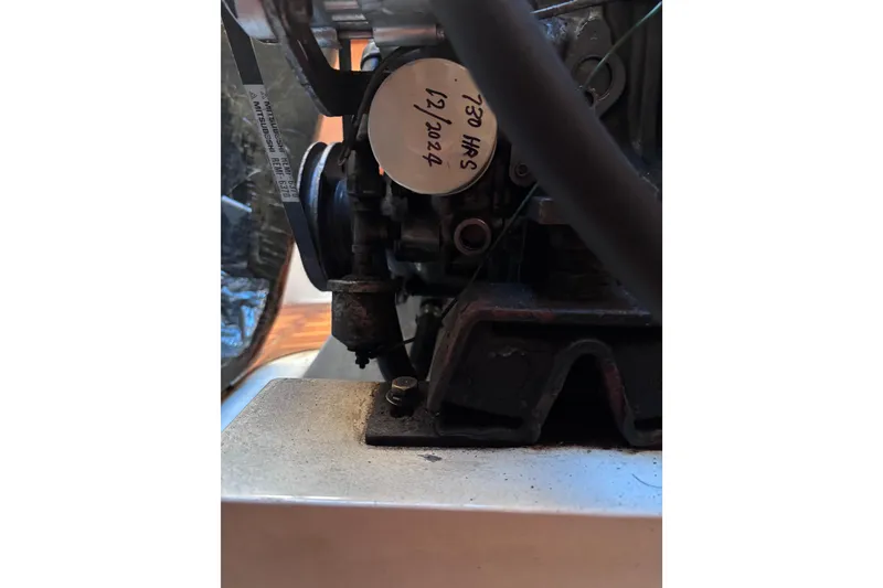 Slide: The Image of Close-up of a CAL 33 engine component, model year 1989, with visible labels and wiring. - 29