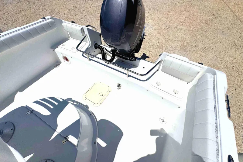 Slide: The Image of 2003 PRO SPORT 2200 Blue Water boat interior with Yamaha outboard motor. - 10