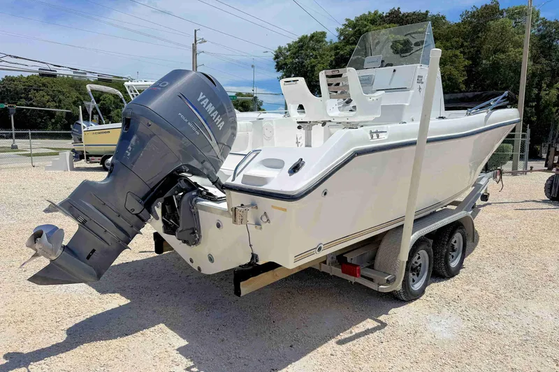 Slide: The Image of 2003 PRO SPORT 2200 Blue Water boat with Yamaha outboard motor on trailer. - 5