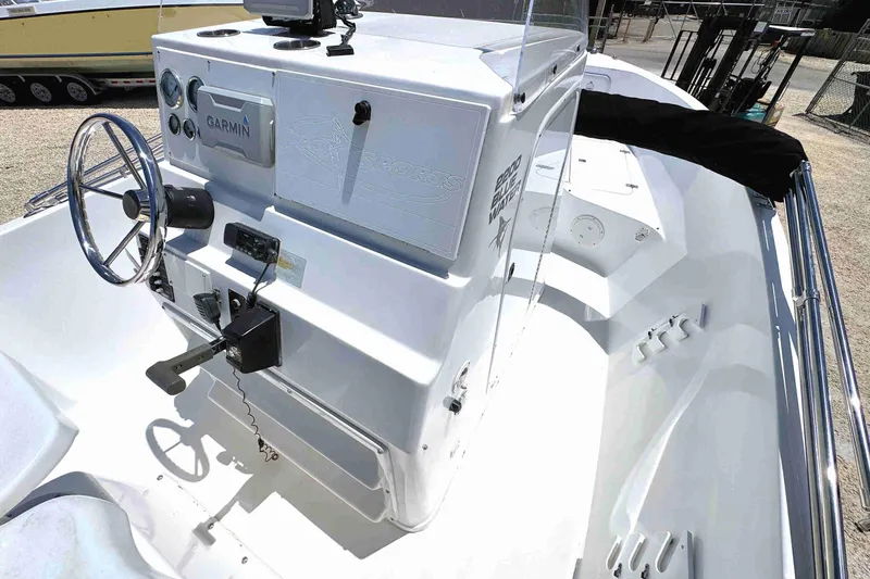 Slide: The Image of 2003 PRO SPORT 2200 Blue Water boat interior with steering wheel and control panel. - 13