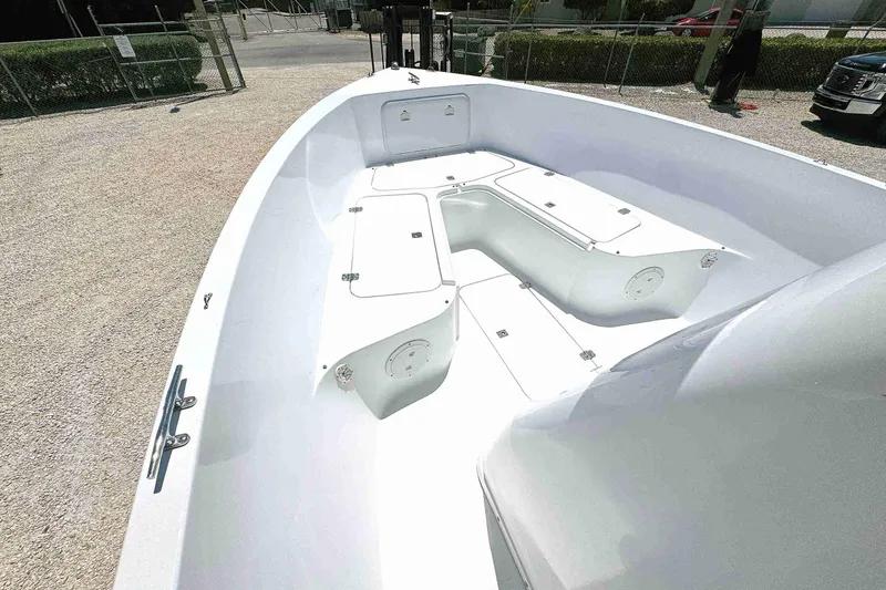 Slide: The Image of 2003 PRO SPORT 2200 Blue Water boat interior with storage compartments and sleek design. - 14