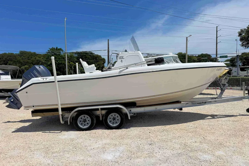Slide: The Image of 2003 PRO SPORT 2200 Blue Water boat on trailer, parked outdoors under clear sky. - 4