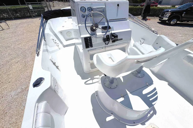 Slide: The Image of 2003 PRO SPORT 2200 Blue Water boat interior with steering console and seating. - 11