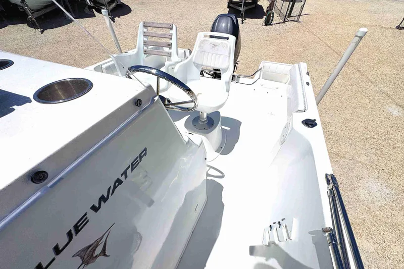 Slide: The Image of 2003 PRO SPORT 2200 Blue Water boat interior with steering wheel and seating. - 8