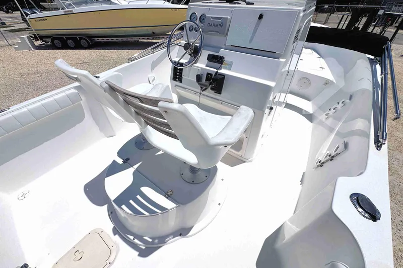 Slide: The Image of 2003 PRO SPORT 2200 Blue Water boat interior with steering console and seating. - 12