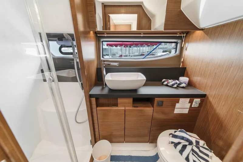 Slide: The Image of Luxurious bathroom interior of 2017 Bavaria R40 Fly yacht with modern fixtures and wooden cabinetry. - 54