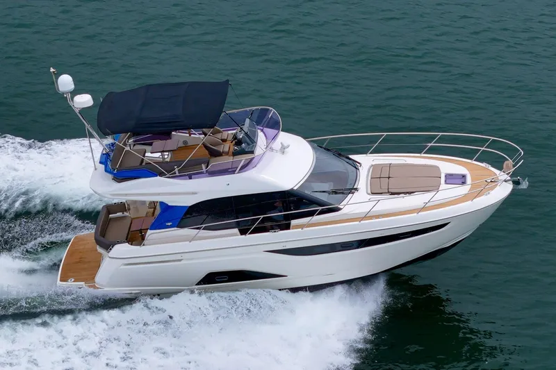Slide: The Image of 2017 Bavaria R40 Fly yacht cruising on open water, showcasing sleek design and luxury features. - 6