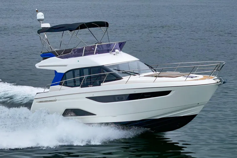 Slide: The Image of 2017 Bavaria R40 Fly yacht cruising on open water, showcasing sleek design and luxury features. - 4