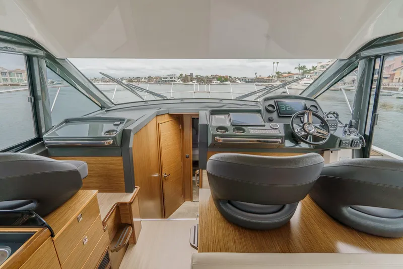 Slide: The Image of Interior view of 2017 Bavaria R40 Fly yacht cockpit with modern controls and panoramic windows. - 39
