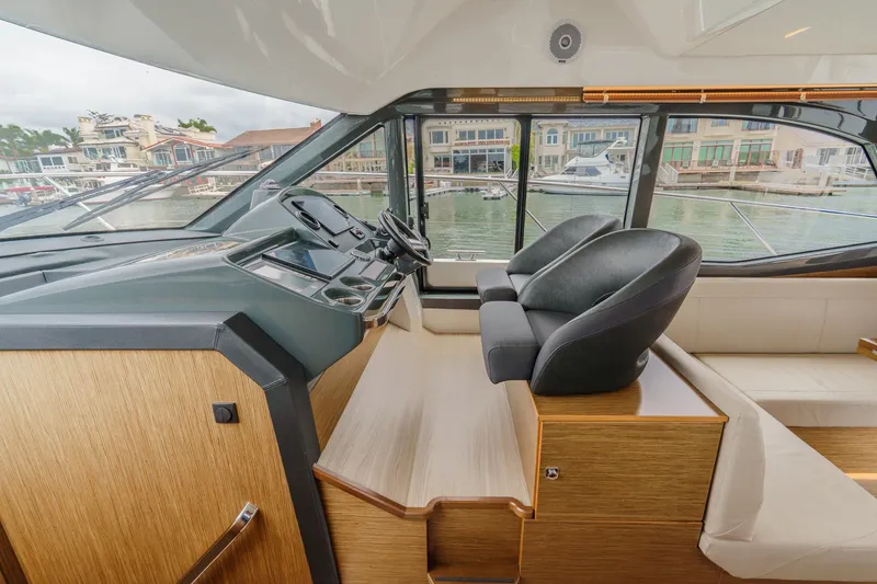 Slide: The Image of Interior of 2017 Bavaria R40 Fly yacht with modern helm and luxurious seating. - 41