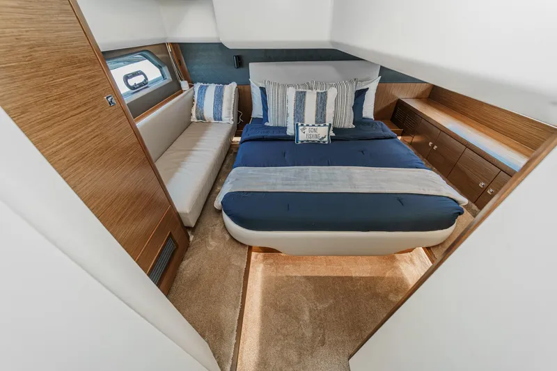 Slide: The Image of Luxurious cabin interior of 2017 Bavaria R40 Fly yacht with cozy bed and elegant wood finishes. - 50
