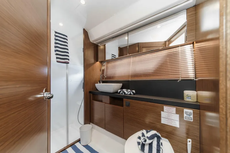 Slide: The Image of Luxurious bathroom interior of 2017 Bavaria R40 Fly yacht with modern wood finish. - 60