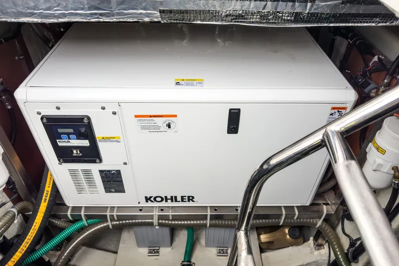 Slide: The Image of Engine room of 2017 Bavaria R40 Fly with Kohler generator installed. - 64