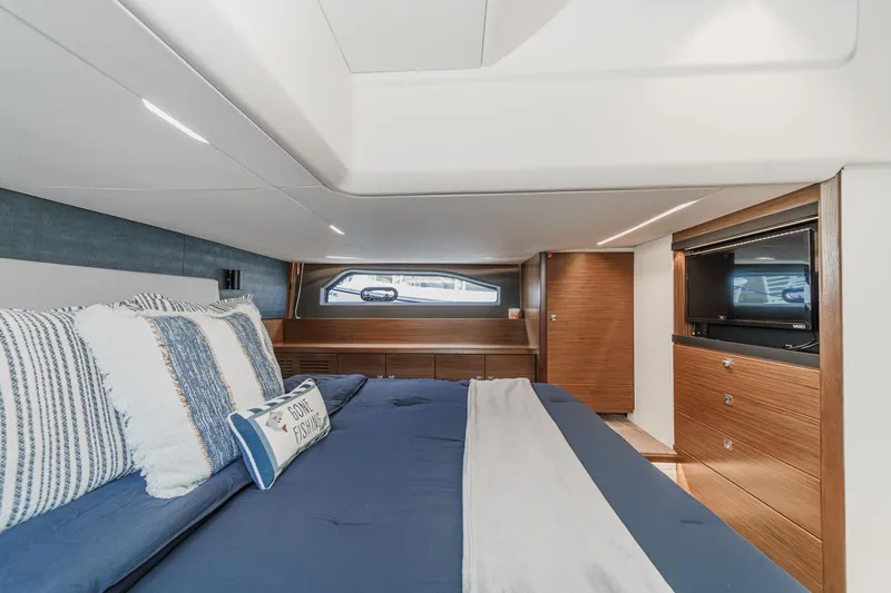 Slide: The Image of Luxurious cabin interior of 2017 Bavaria R40 Fly yacht with elegant bedding and wood accents. - 52