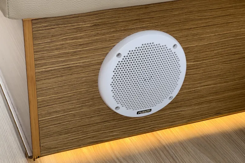 Slide: The Image of White Fusion speaker on wood panel in 2017 Bavaria R40 Fly yacht interior. - 35