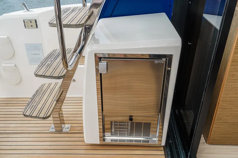Slide: The Image of Stainless steel fridge on 2017 Bavaria R40 Fly yacht with wooden steps. - 22