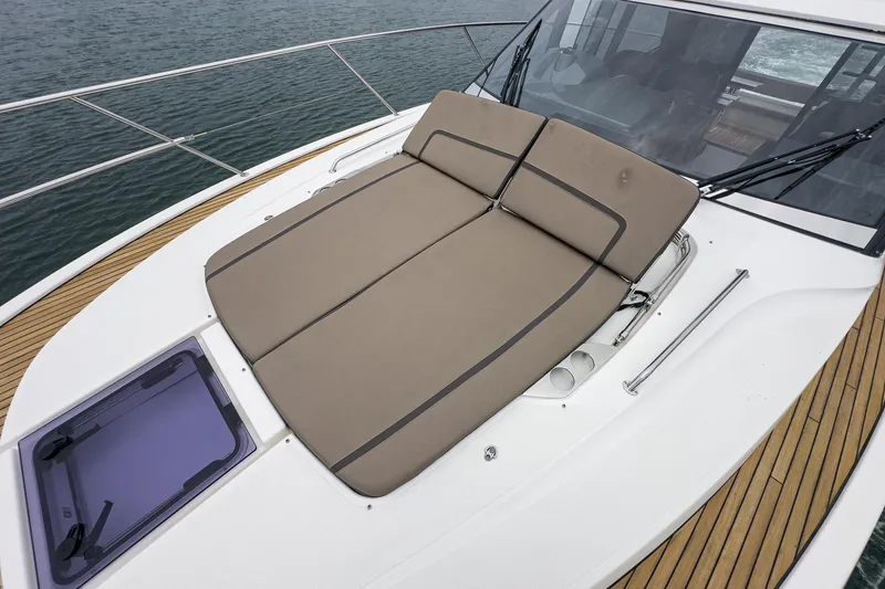Slide: The Image of 2017 Bavaria R40 Fly yacht with cushioned sun deck and sleek design. - 11