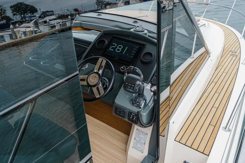 Slide: The Image of 2017 Bavaria R40 Fly yacht cockpit with modern steering and navigation controls. - 43