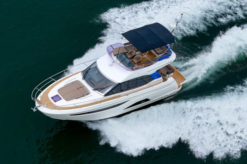 Slide: The Image of 2017 Bavaria R40 Fly yacht cruising on open water, top view. - 3