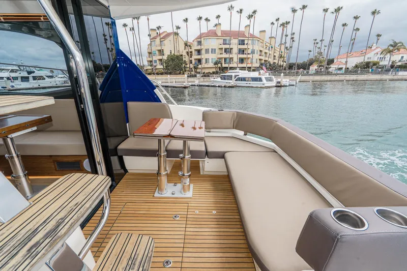 Slide: The Image of Luxurious 2017 Bavaria R40 Fly yacht deck with elegant seating and waterfront view. - 23