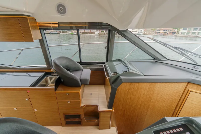 Slide: The Image of Interior of 2017 Bavaria R40 Fly yacht with modern helm and seating area. - 47