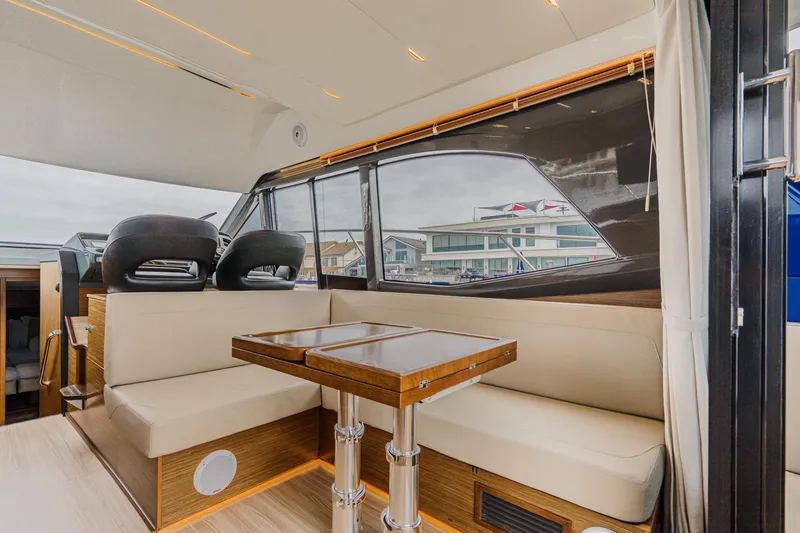 Slide: The Image of Interior of 2017 Bavaria R40 Fly yacht with elegant seating and wooden table. - 36