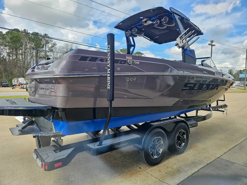 Slide: The Image of 2021 Supra SE 450 on a trailer, ready for adventure. - 6
