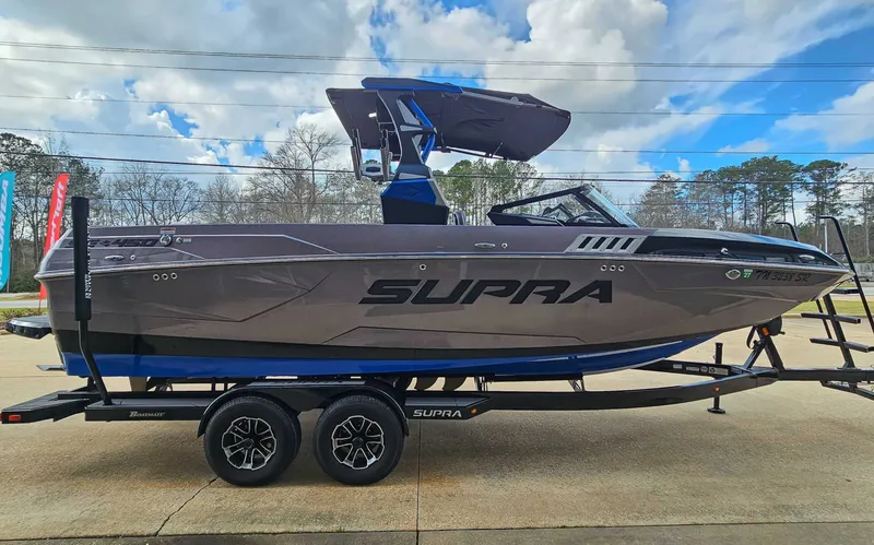 Slide: The Image of 2021 Supra SE 450 on a trailer, ready for adventure. - 5