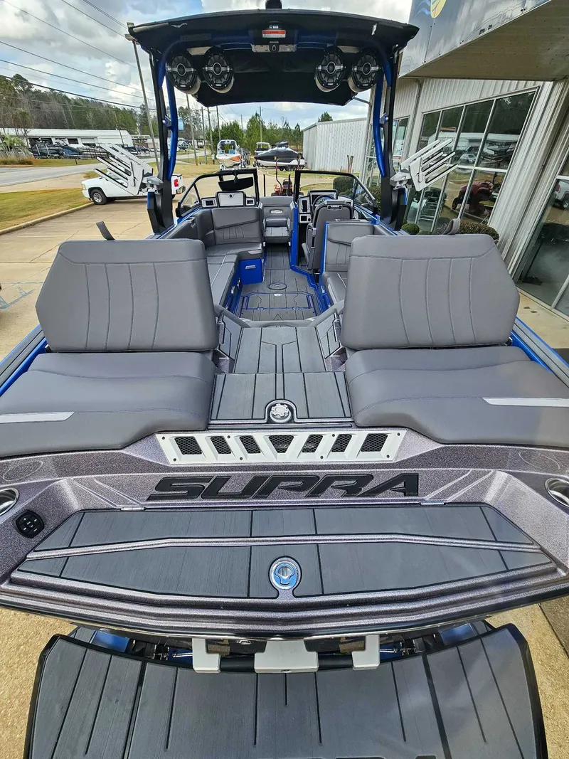 Slide: The Image of 2021 Supra SE 450: Luxurious interior with gray seating and modern design. - 9