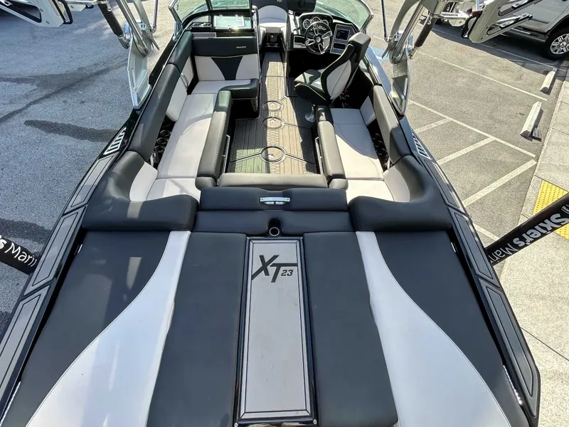 Slide: The Image of Interior view of a MasterCraft XT23 boat with stylish seating and modern design. - 10