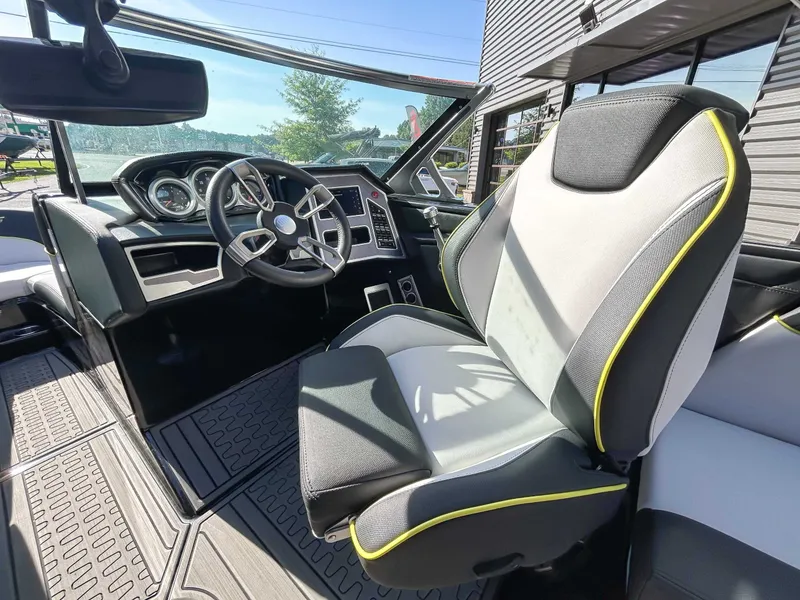 Slide: The Image of Interior of a 2020 MasterCraft XT23 with a modern steering wheel and comfortable seating. - 17