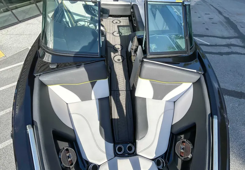 Slide: The Image of The image shows the cockpit of a 2020 MasterCraft XT23 boat with modern seating. - 13