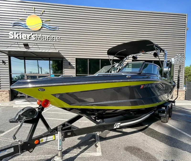 Slide: The Image of A 2020 MasterCraft XT23 on a trailer in front of a building. - 5