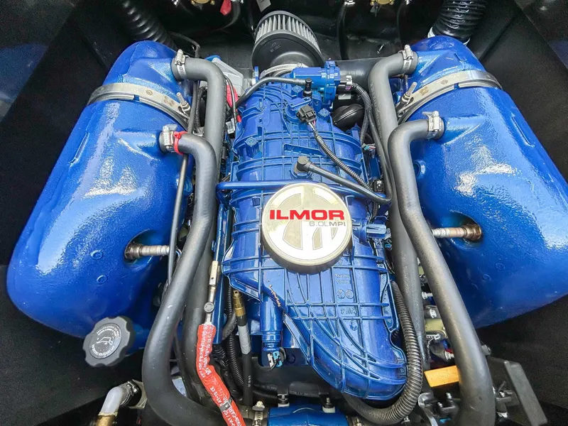 Slide: The Image of The engine compartment of a 2020 MasterCraft XT23 features a blue Ilmor engine. - 22