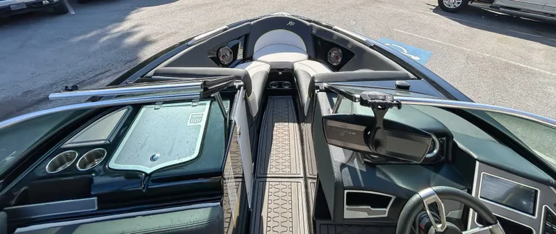 Slide: The Image of The image shows the cockpit of a 2020 MasterCraft XT23 boat with modern controls. - 11