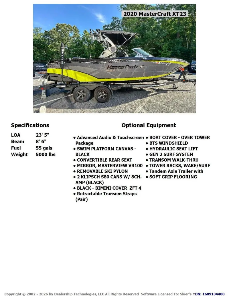 Slide: The Image of 2020 MasterCraft XT23 on a trailer with yellow and black design. - 2
