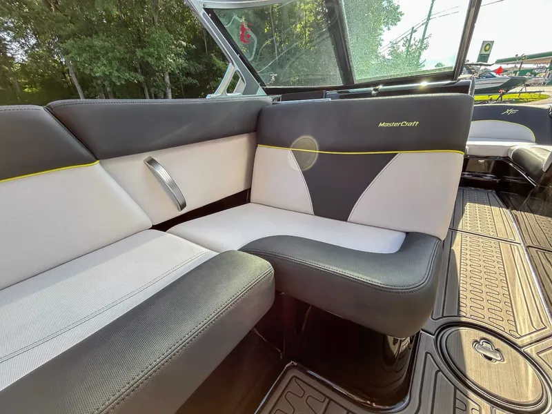 Slide: The Image of Interior of a 2020 MasterCraft XT23 with stylish seating and modern design. - 16