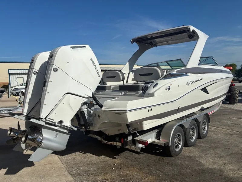 Slide: The Image of A modern 2027 Crownline 331SXSS with twin outboard engines on a trailer. - 22