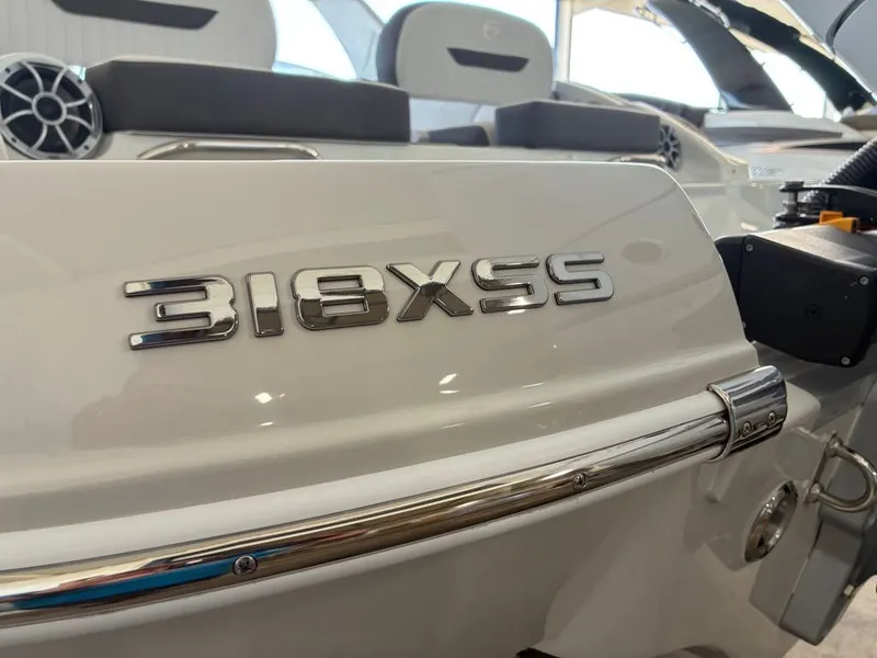 Slide: The Image of Close-up of the stern of a Crownline 331SXSS boat with a shiny nameplate. - 6