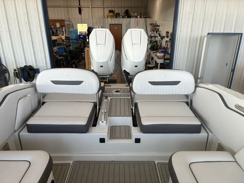Slide: The Image of The image shows the cockpit of a 2027 Crownline 331SXSS boat with two engines. - 4