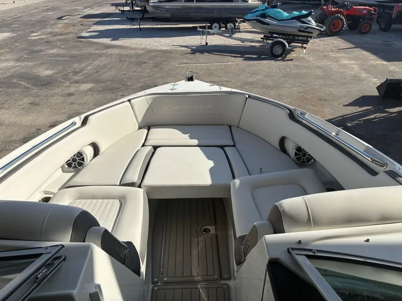 Slide: The Image of The image shows the bow area of a Crownline 331SXSS boat with beige upholstery. - 7