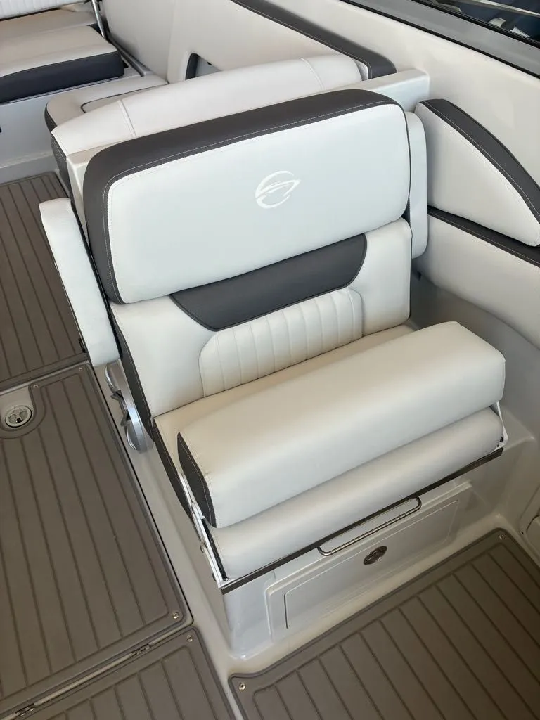 Slide: The Image of A luxurious, cushioned seat with gray and white accents on a boat. - 12