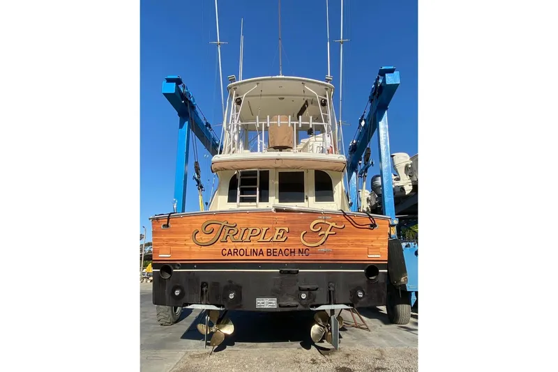 Slide: The Image of 1987 Post 43 Convertible boat "Triple F" at Carolina Beach, NC, in dry dock. - 2