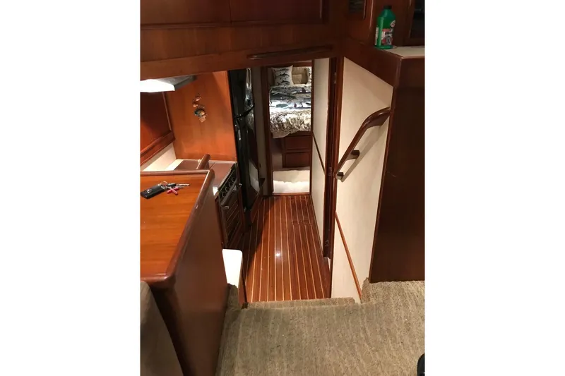 Slide: The Image of Interior of 1987 Post 43 Convertible yacht with wooden flooring and cozy cabin. - 14