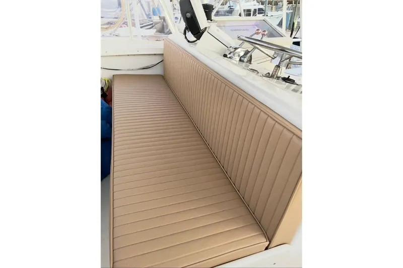 Slide: The Image of Tan leather seating on a 1987 Post 43 Convertible boat. - 12