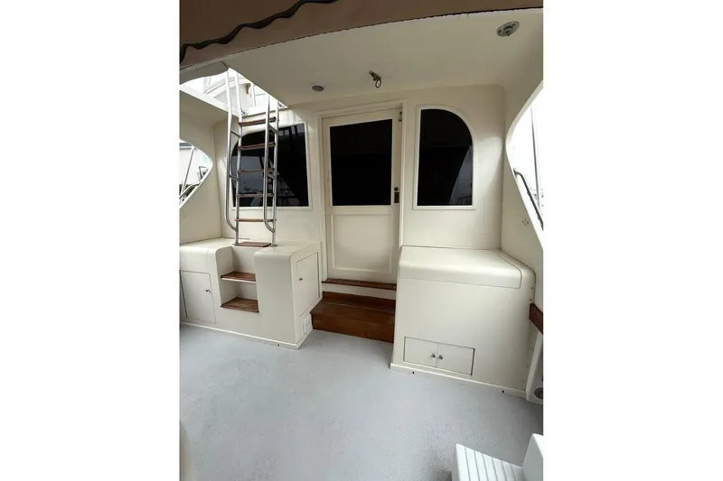Slide: The Image of 1987 Post 43 Convertible yacht interior with stairs and seating area. - 7