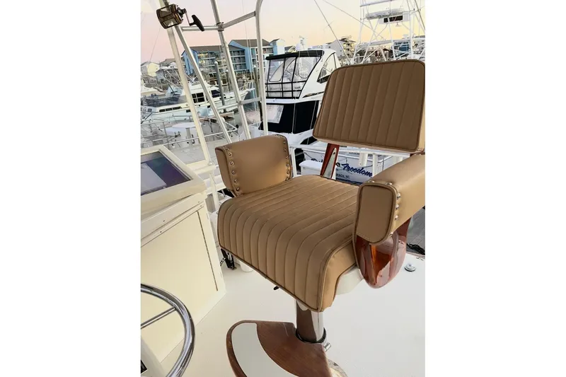 Slide: The Image of Captain's chair on 1987 Post 43 Convertible yacht, docked at marina. - 11