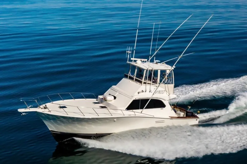 The Image of 1987 Post 43 Convertible yacht cruising on open water. - 1