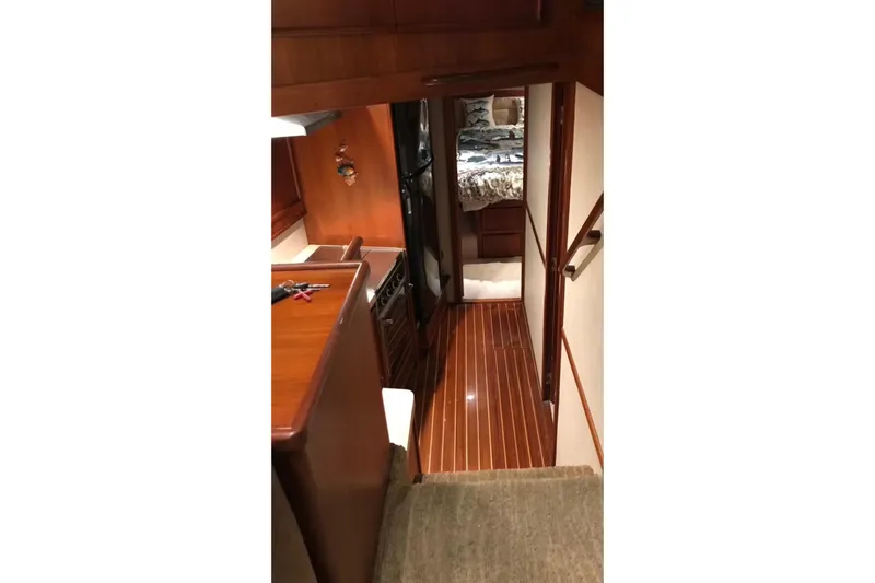 Slide: The Image of Interior of 1987 Post 43 Convertible yacht with wood flooring and cozy cabin. - 24