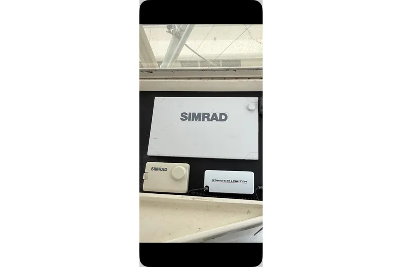 Slide: The Image of Simrad and Standard Horizon marine electronics on 1987 Post 43 Convertible yacht. - 26